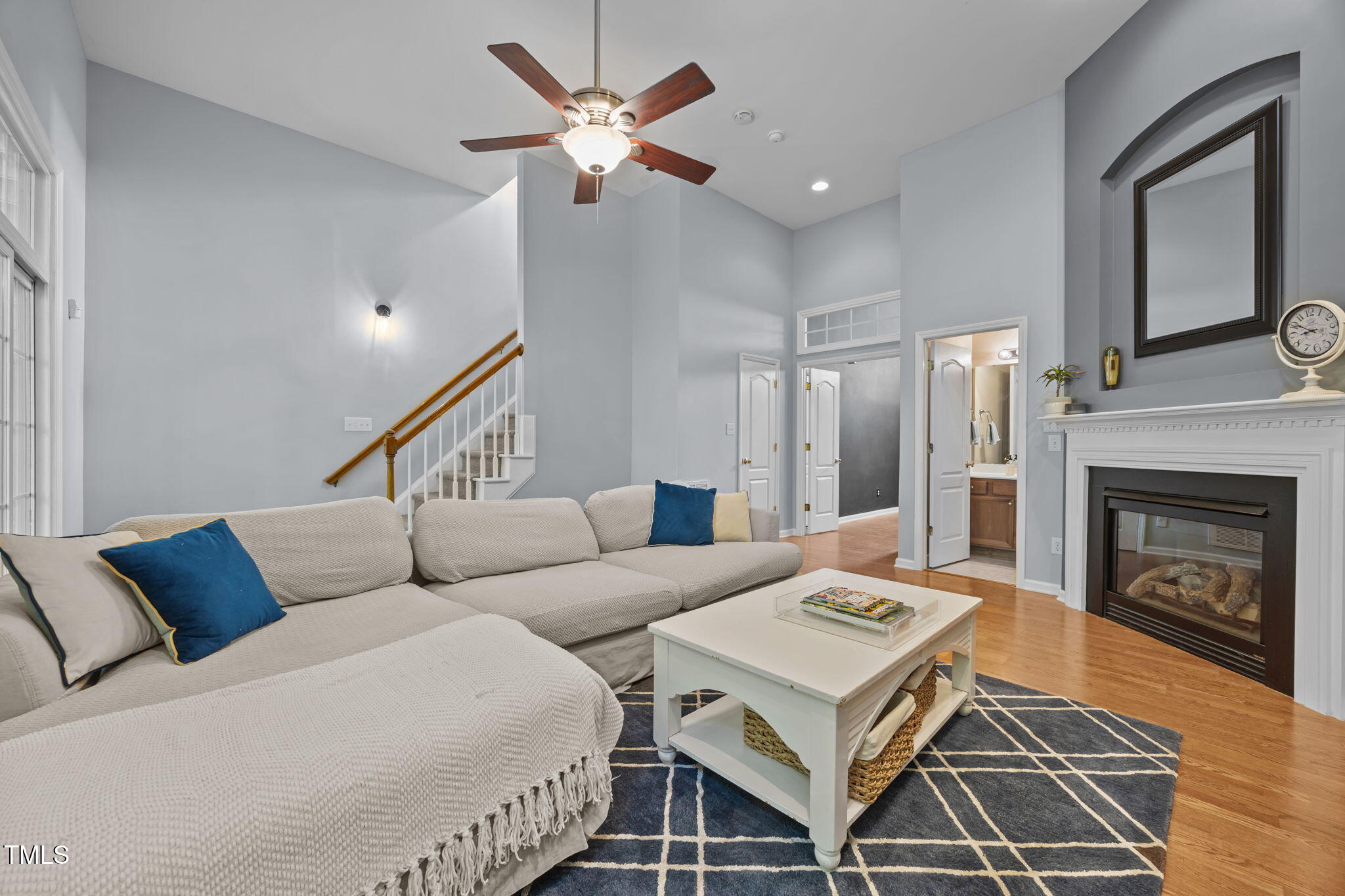 6825 Middleboro Drive Raleigh, NC 27612 - Photo 33 of 38 a living room with furniture and a fireplace