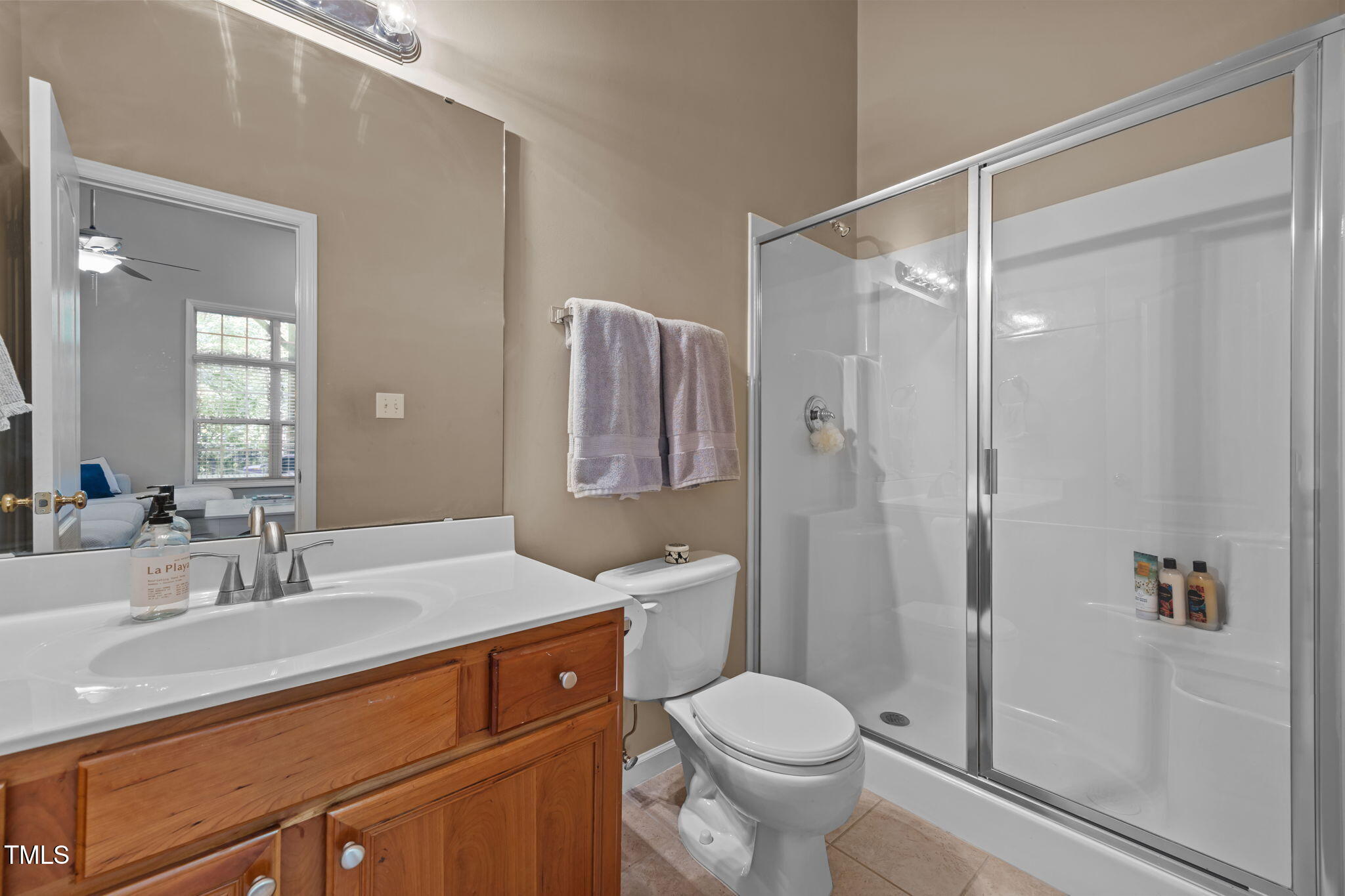 6825 Middleboro Drive Raleigh, NC 27612 - Photo 34 of 38 a bathroom with a sink a toilet and shower