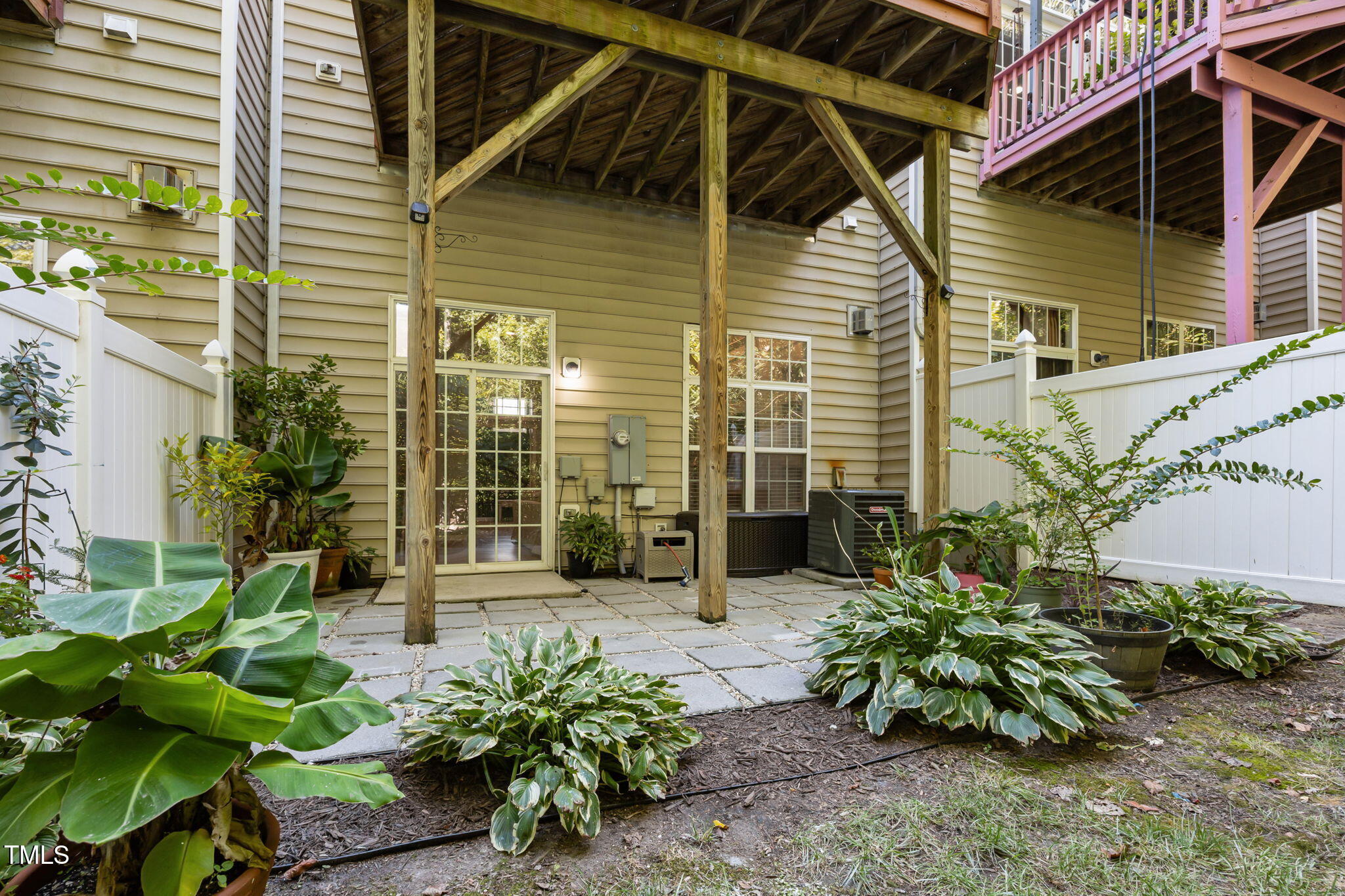 6825 Middleboro Drive Raleigh, NC 27612 - Photo 37 of 38 a house with a flower garden