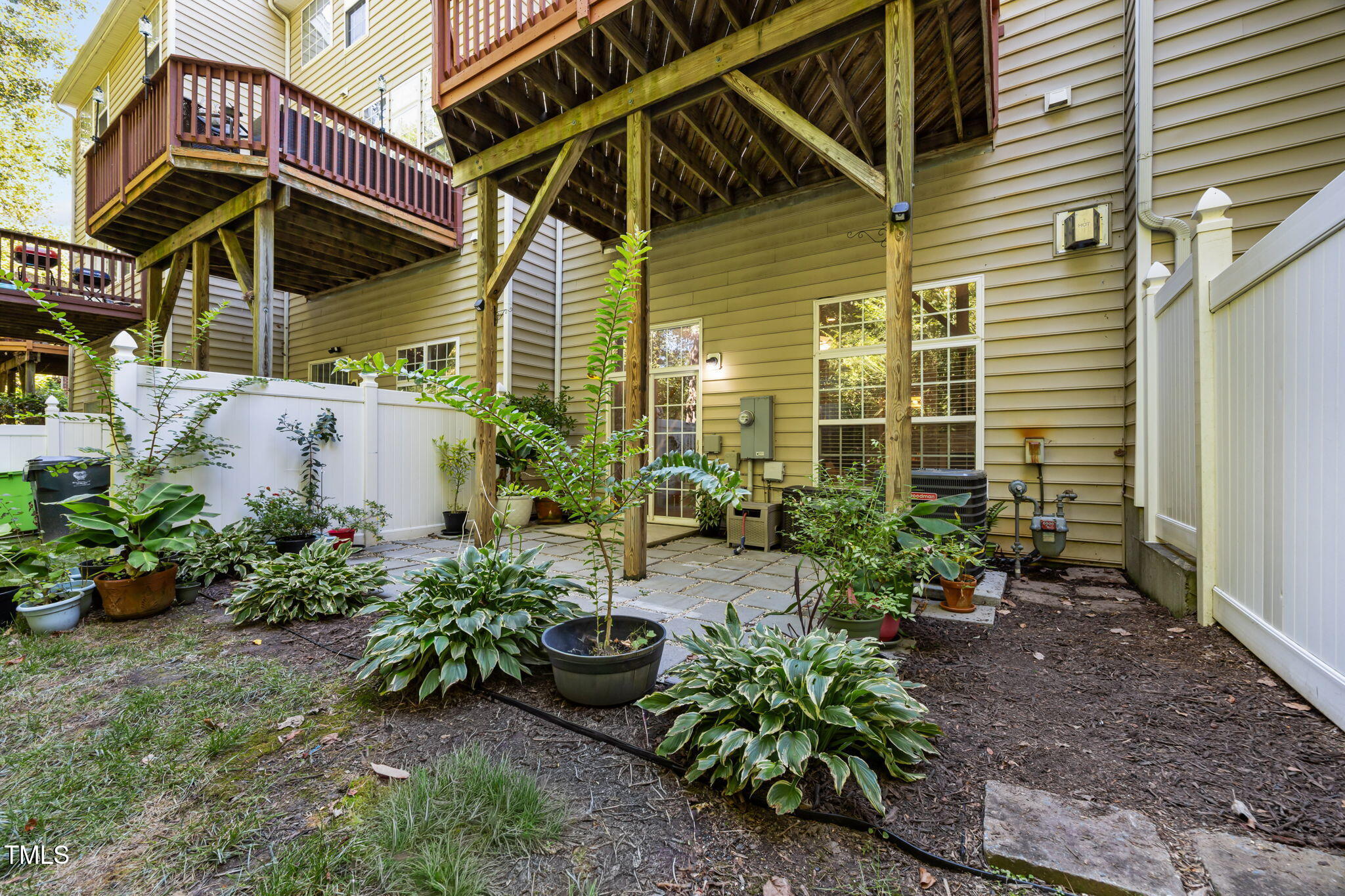 6825 Middleboro Drive Raleigh, NC 27612 - Photo 38 of 38 a view of a backyard with potted plants