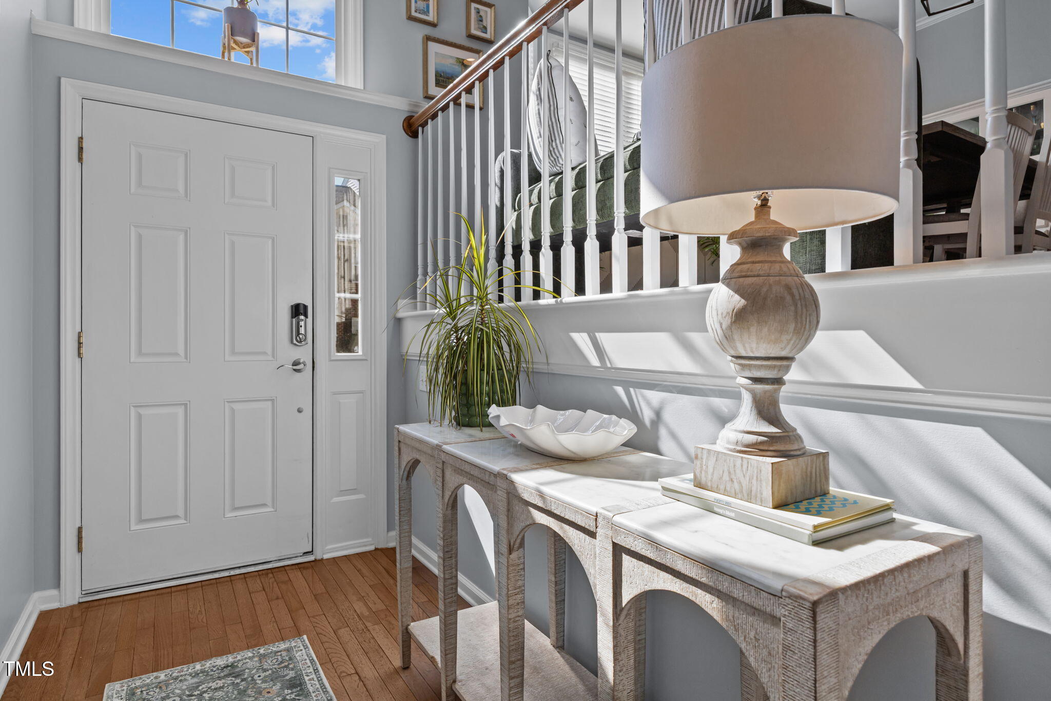 6825 Middleboro Drive Raleigh, NC 27612 - Photo 4 of 38 a view of a kitchen area with furniture and wooden floor