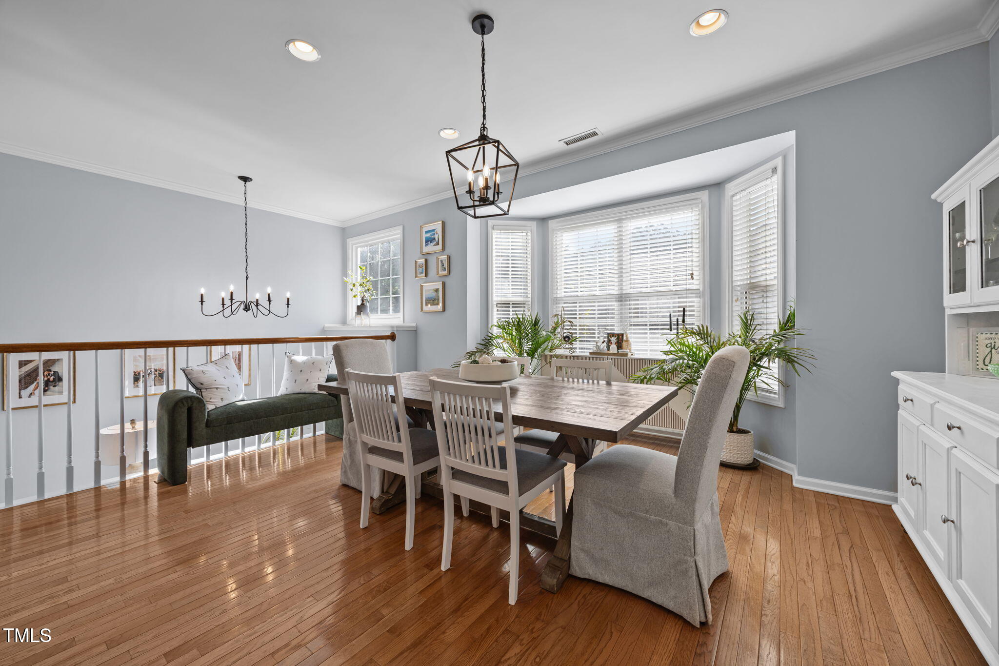6825 Middleboro Drive Raleigh, NC 27612 - Photo 7 of 38 a view of a dining room with furniture window and wooden floor