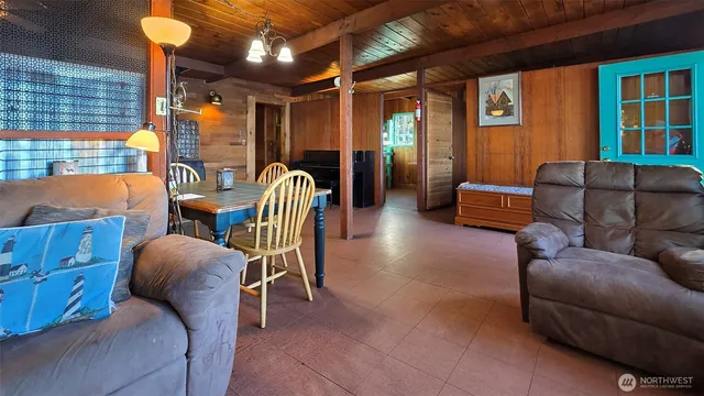a view of a livingroom with furniture and windows