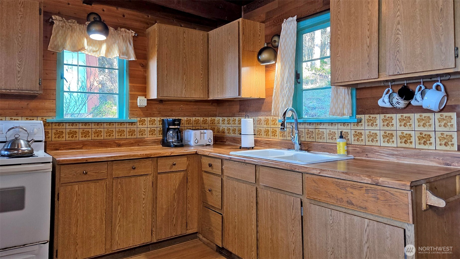 24 Starboard Road Lopez Island, WA 98261 - Photo 13 of 23 a kitchen with a sink cabinets and window