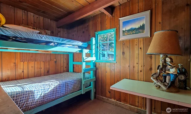 a bedroom with bed and a closet