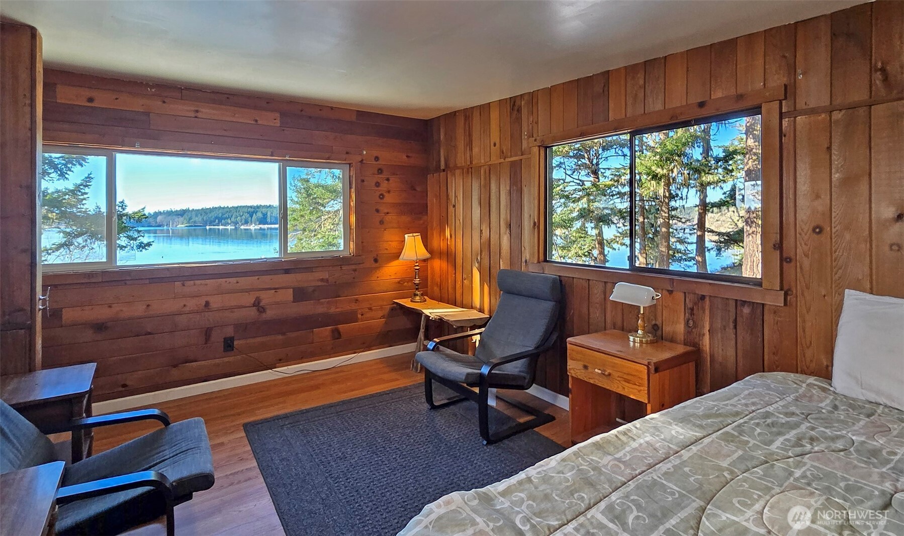 24 Starboard Road Lopez Island, WA 98261 - Photo 17 of 23 a bedroom with a bed and a large window with balcony view