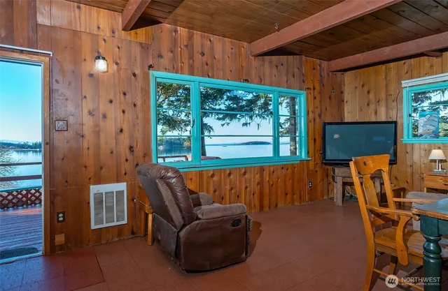 a balcony with furniture and a potted plant