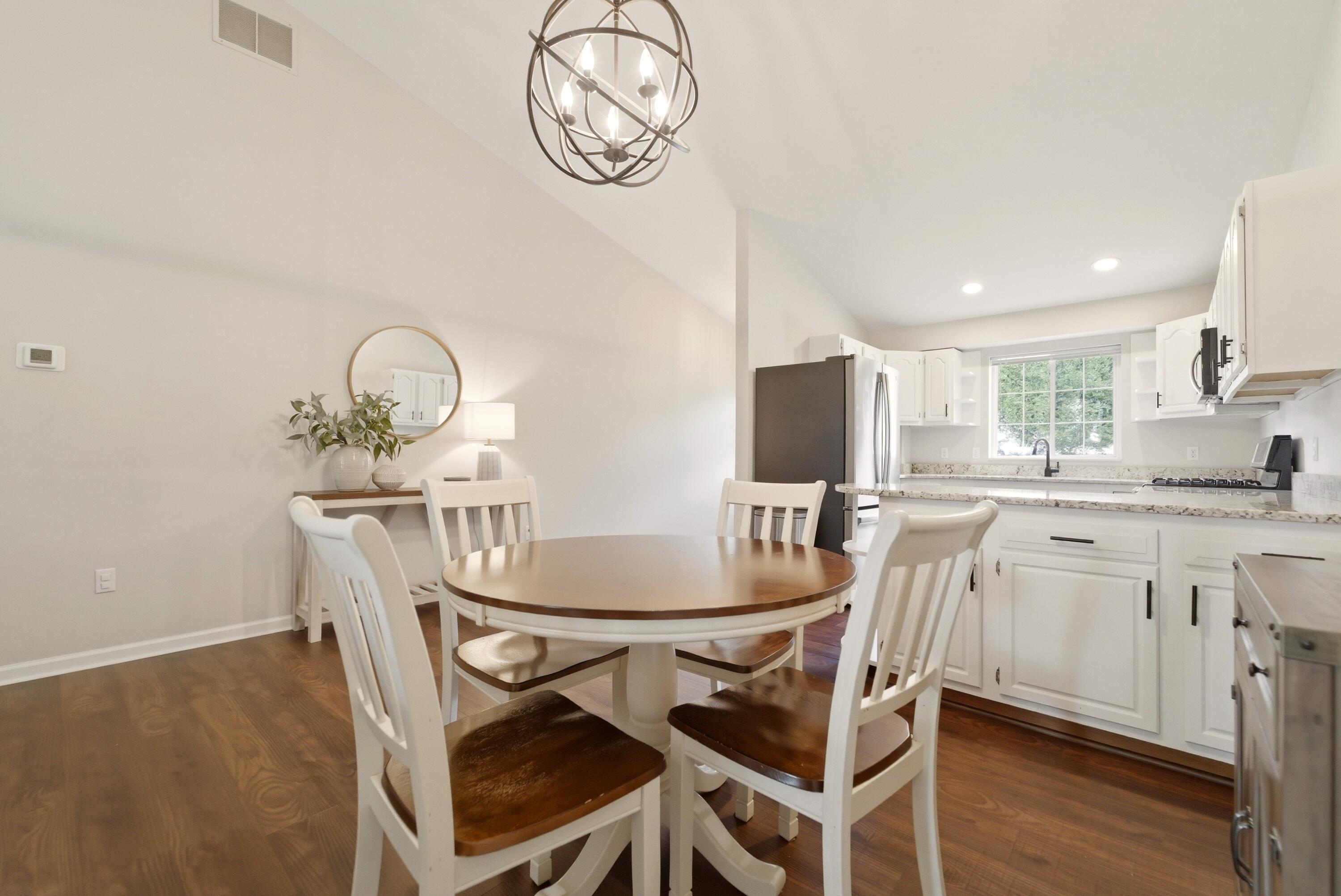 2037 Texas Street Chesterton, IN 46304 - Photo 11 of 26 a view of a dining room with furniture and wooden floor