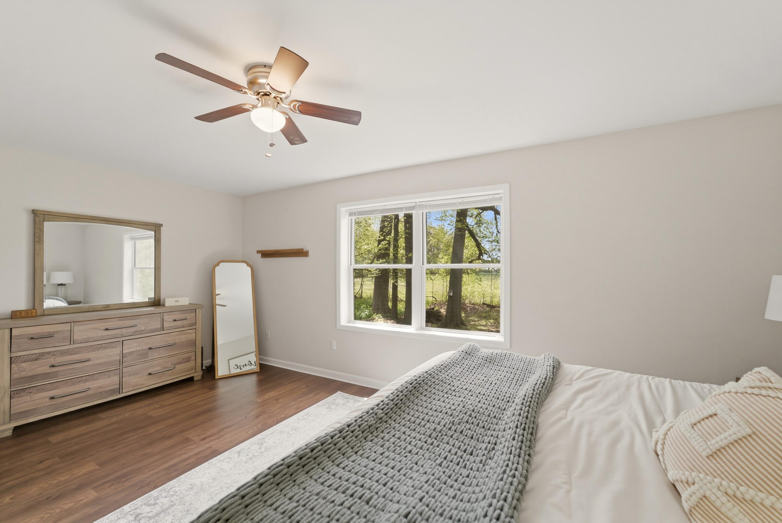 2037 Texas Street Chesterton, IN 46304 - Photo 16 of 26 a view of a bedroom with wooden floor and window