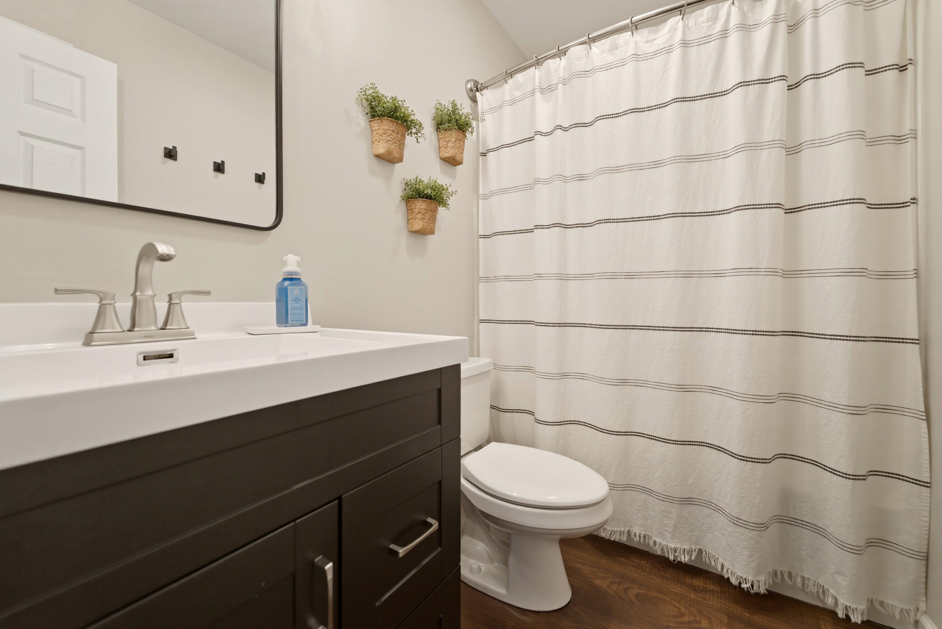 2037 Texas Street Chesterton, IN 46304 - Photo 19 of 26 a bathroom with a sink mirror and toilet