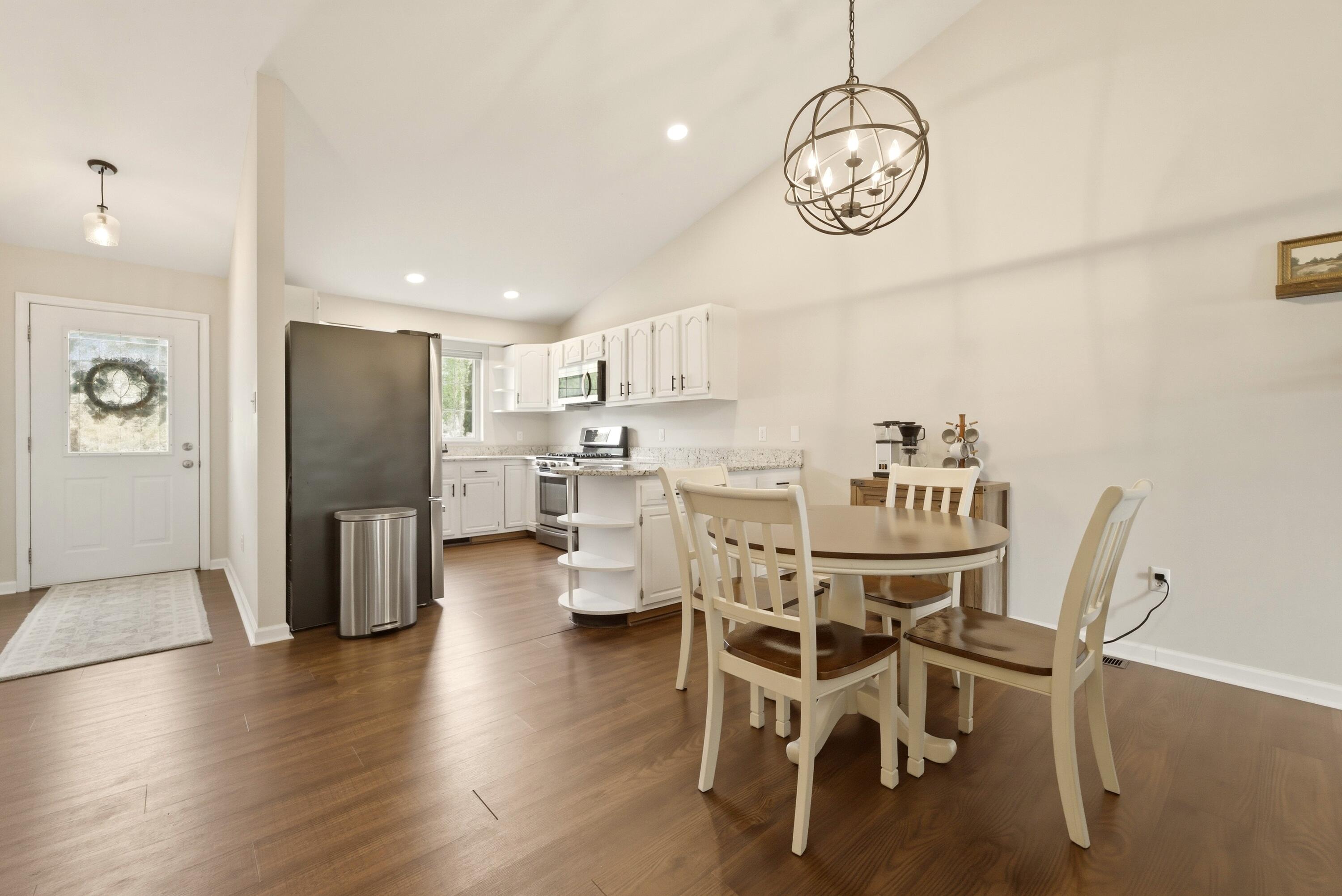2037 Texas Street Chesterton, IN 46304 - Photo 5 of 26 a view of a dining room with furniture and wooden floor