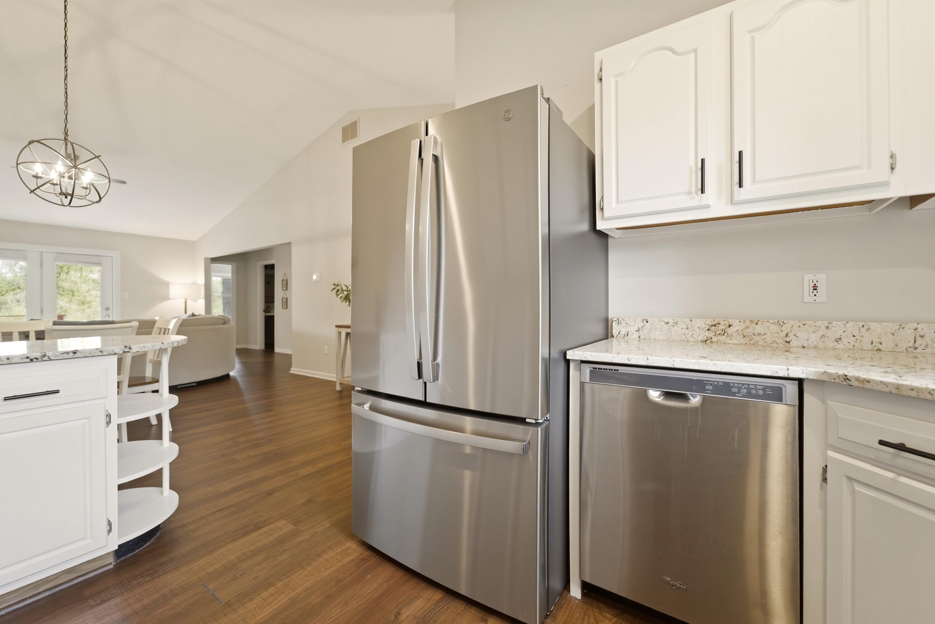 2037 Texas Street Chesterton, IN 46304 - Photo 9 of 26 a kitchen with a refrigerator sink and cabinets