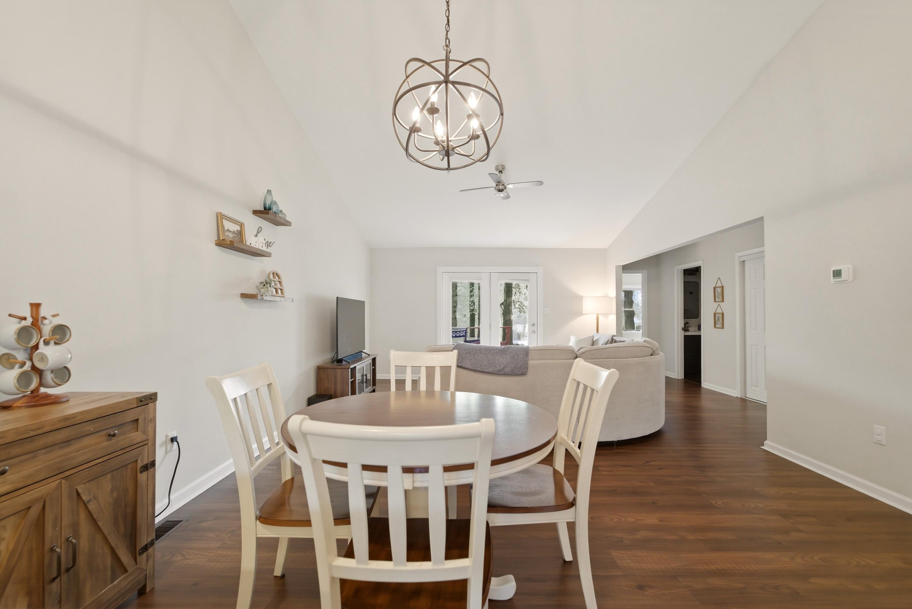 2037 Texas Street Chesterton, IN 46304 - Photo 10 of 26 a view of a dining room with furniture a chandelier and wooden floor