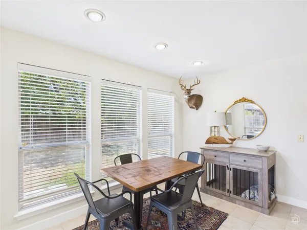 a view of a dining room with furniture and window