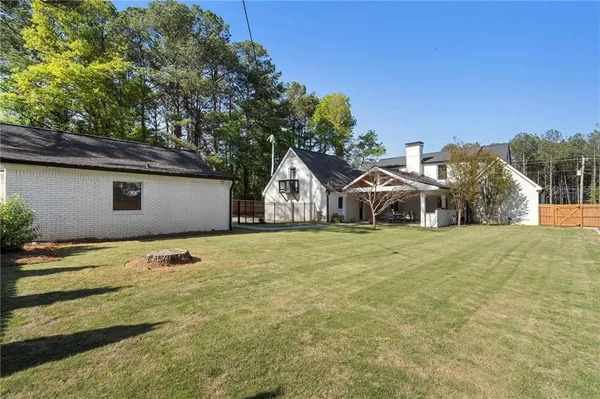 $875,000 | 403 Rockbridge Road Southwest, Lilburn, GA 30047