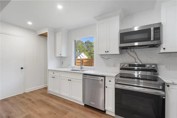 $875,000 | 403 Rockbridge Road Southwest, Lilburn, GA 30047