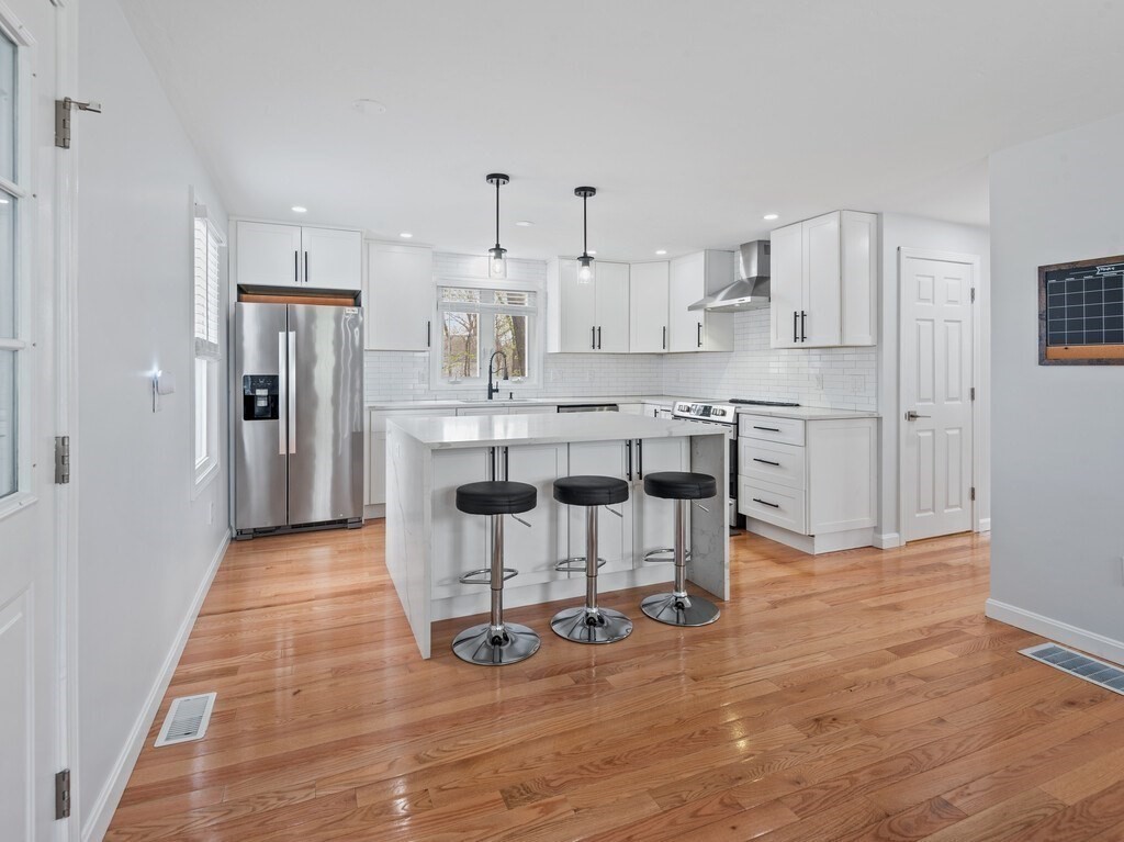 2 Stringer Dam Road Shrewsbury, MA 01545 - Photo 12 of 35 a kitchen with stainless steel appliances granite countertop a refrigerator and a stove top oven