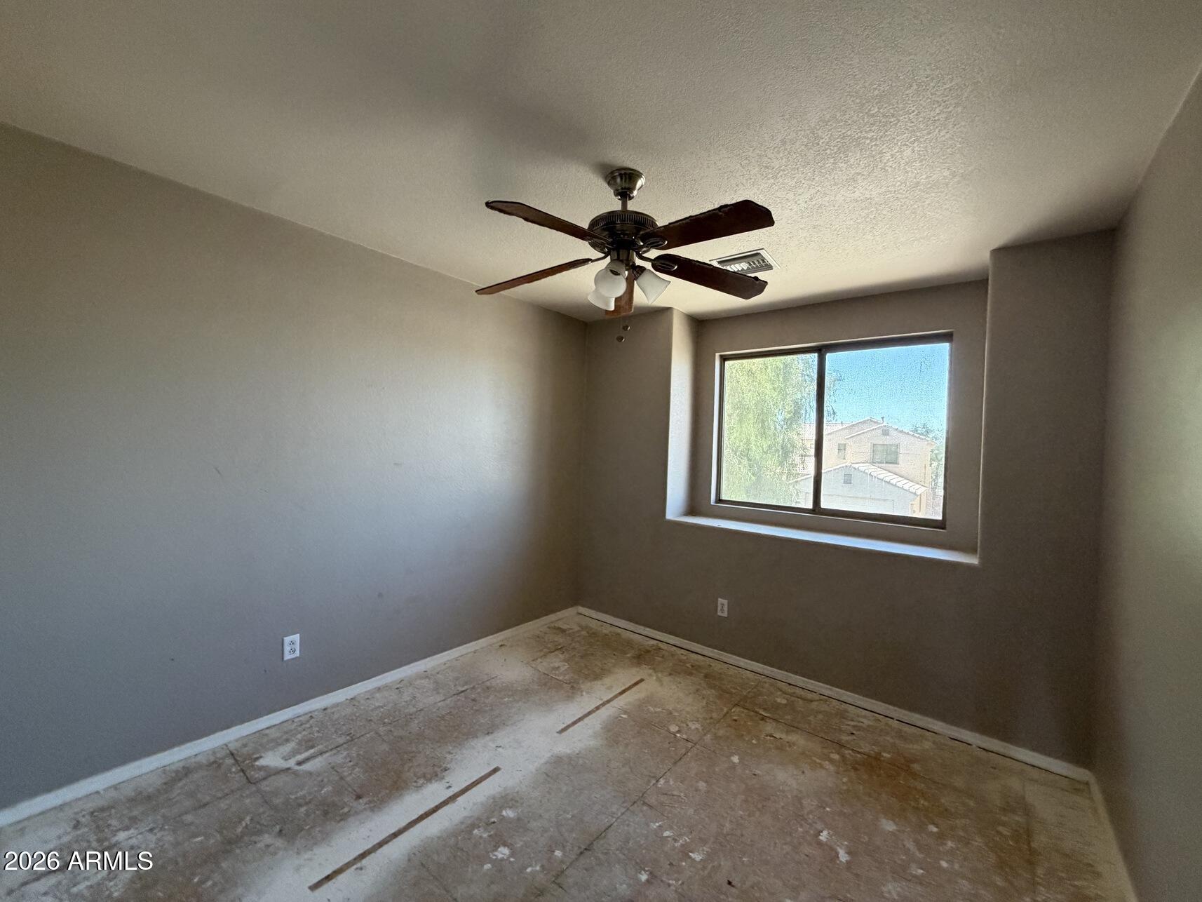 10807 West Monte Vista Road Avondale, AZ 85392 - Photo 22 of 33 a view of an empty room with a window