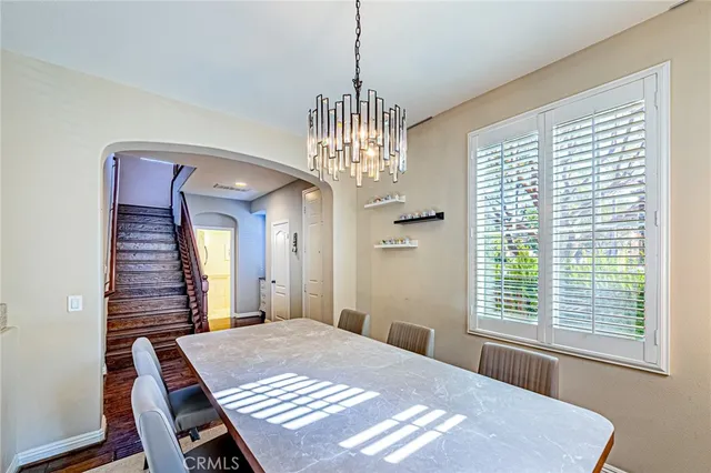 a view of a dining room with furniture and window