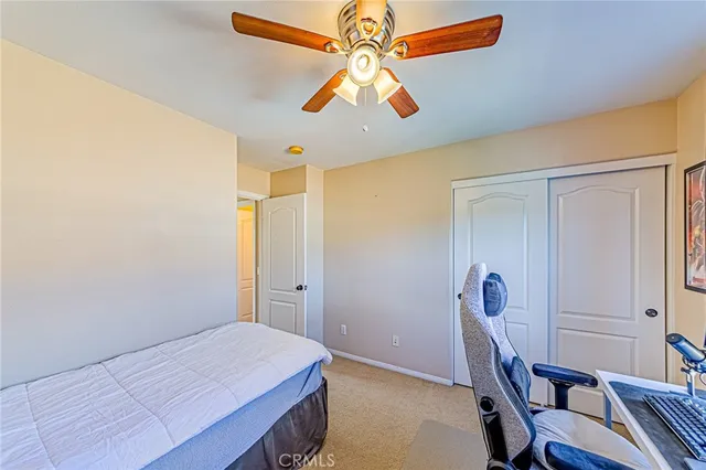 a spacious bathroom with a double vanity sink a mirror and a toilet