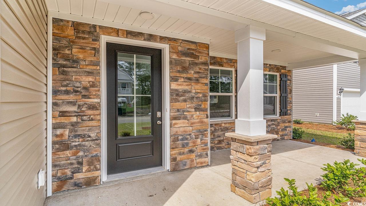 748 Doonbeg Court Conway, SC 29526 - Photo 2 of 30 Entrance to property featuring stone siding and a porch