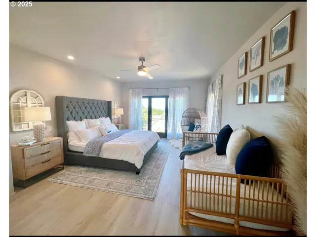 a bedroom with furniture and wooden floor