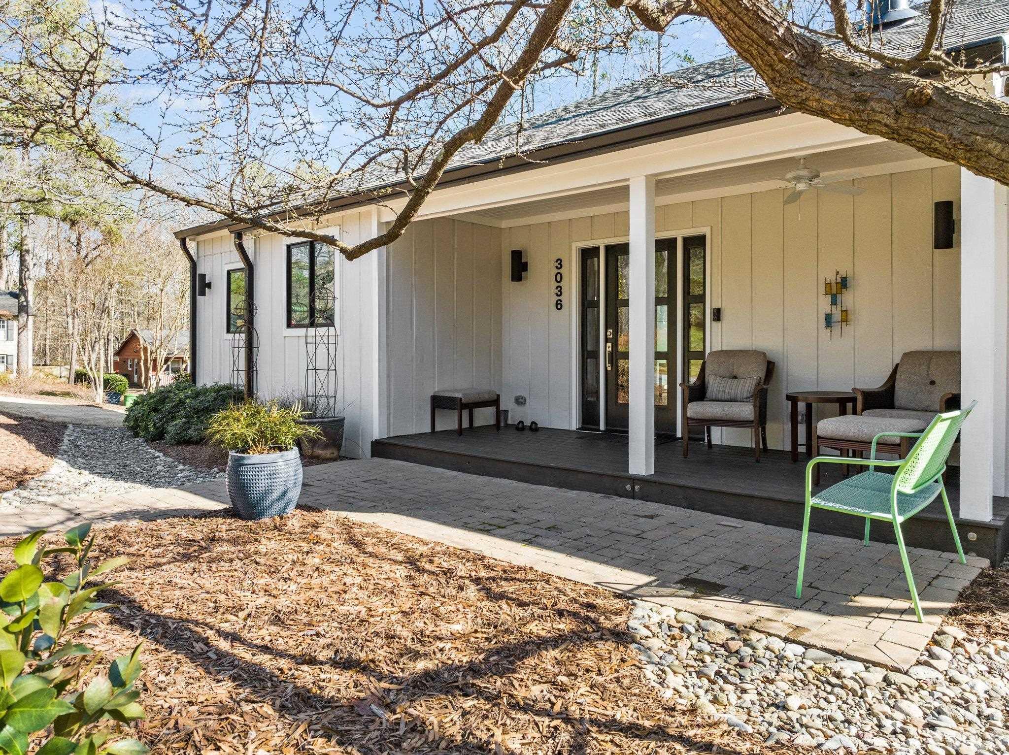 3036 Sylvania Drive Raleigh, NC 27607 - Photo 11 of 59 a view of a patio with table and chairs potted plants