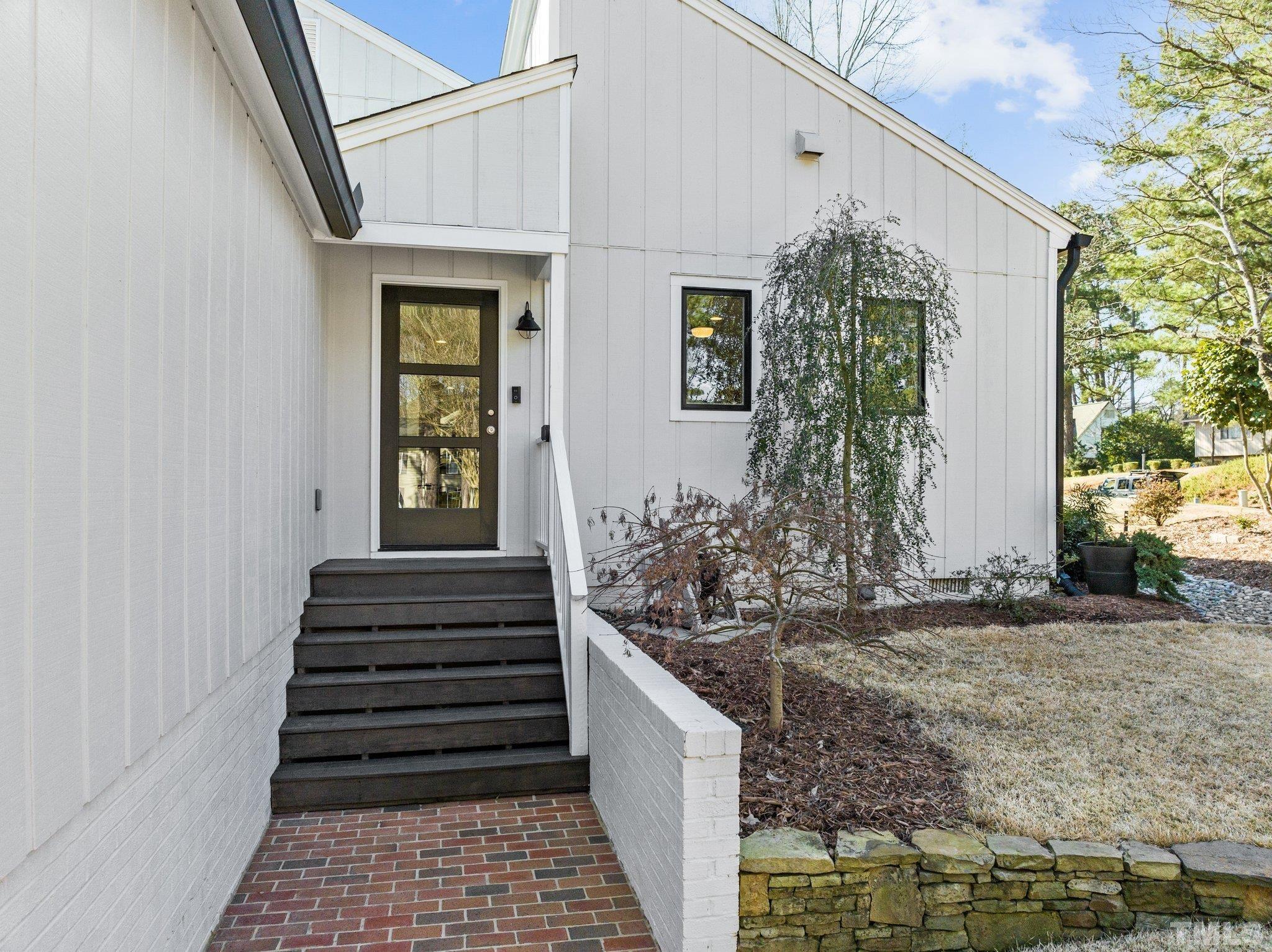 3036 Sylvania Drive Raleigh, NC 27607 - Photo 13 of 59 a front view of a house with a yard