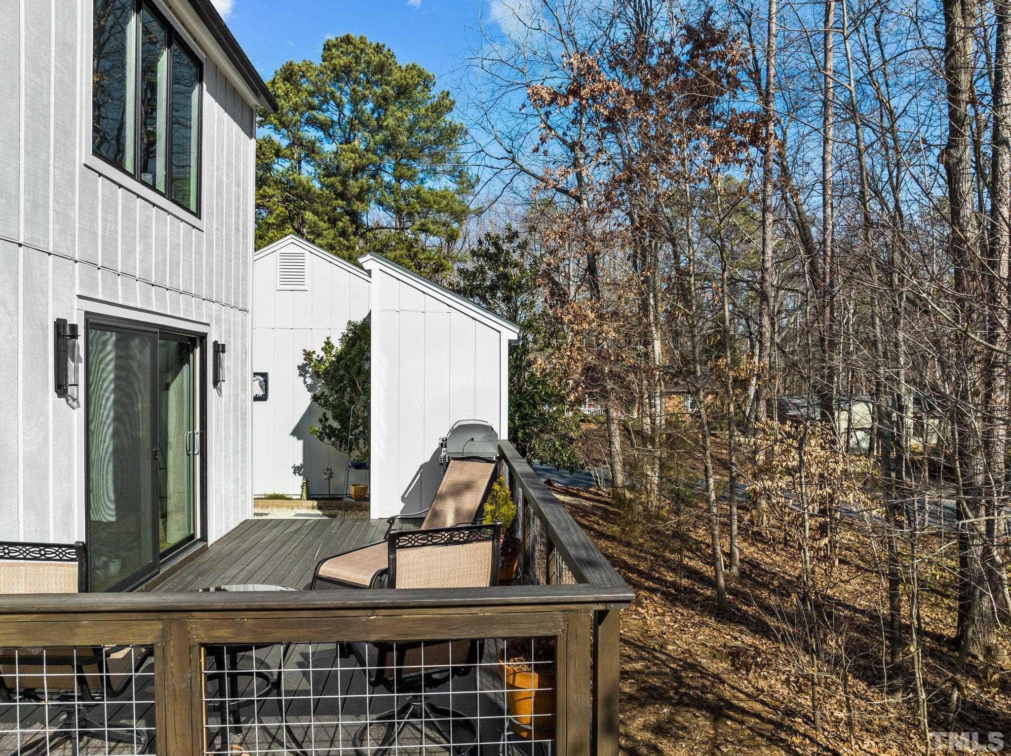 3036 Sylvania Drive Raleigh, NC 27607 - Photo 21 of 59 a view of house with large windows and a tree