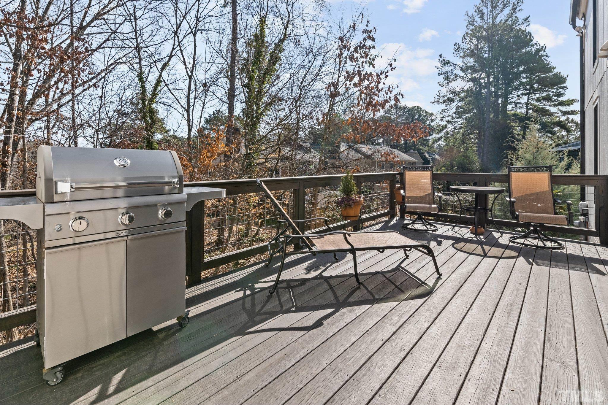 3036 Sylvania Drive Raleigh, NC 27607 - Photo 28 of 59 a view of a balcony with furniture and wooden floor