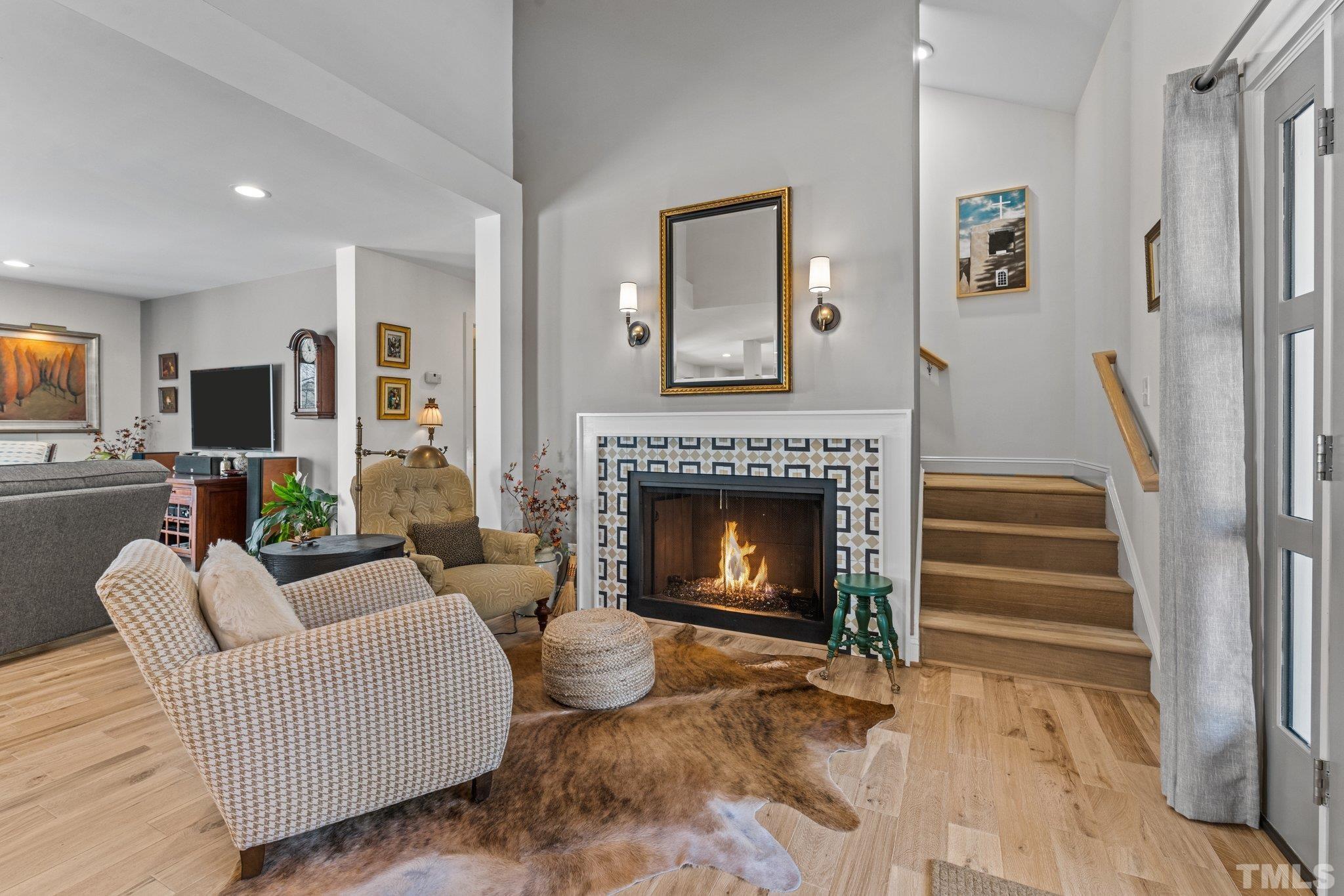 3036 Sylvania Drive Raleigh, NC 27607 - Photo 30 of 59 a living room with furniture and a fireplace