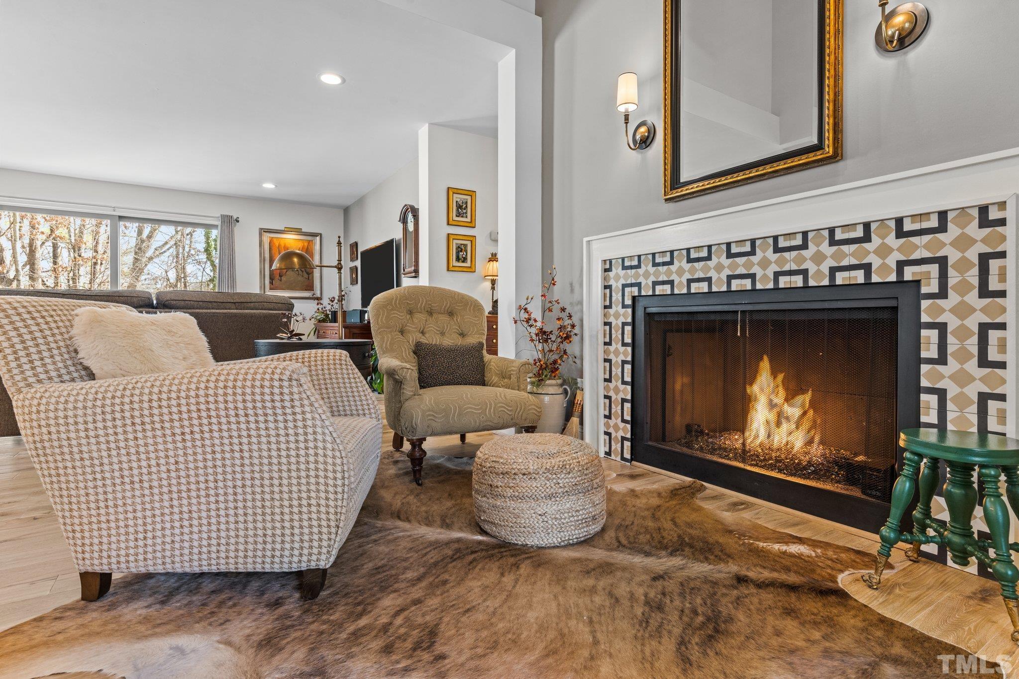 3036 Sylvania Drive Raleigh, NC 27607 - Photo 3 of 59 a living room with furniture and a fireplace