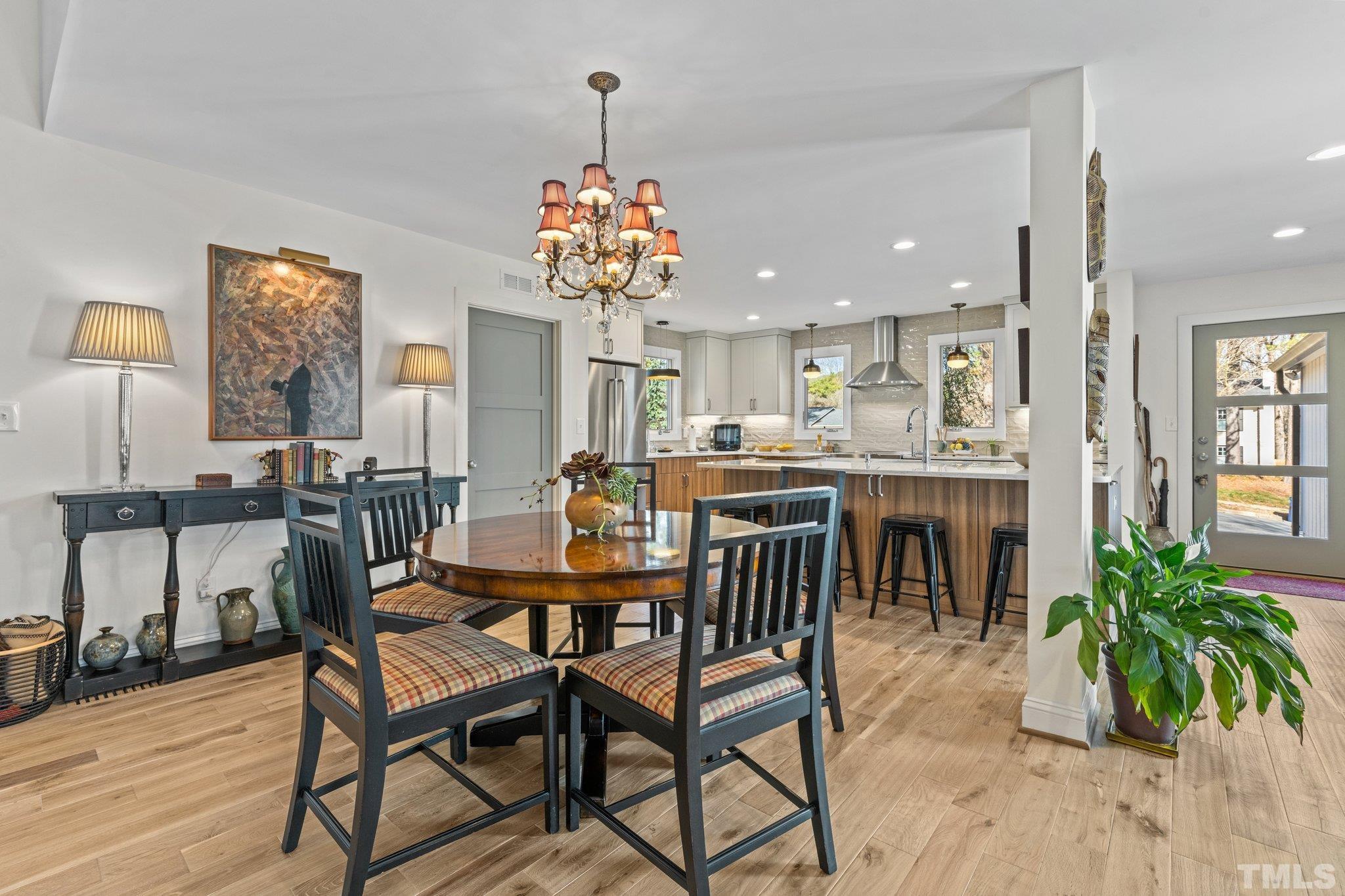 3036 Sylvania Drive Raleigh, NC 27607 - Photo 32 of 59 a view of a dining room with furniture and wooden floor