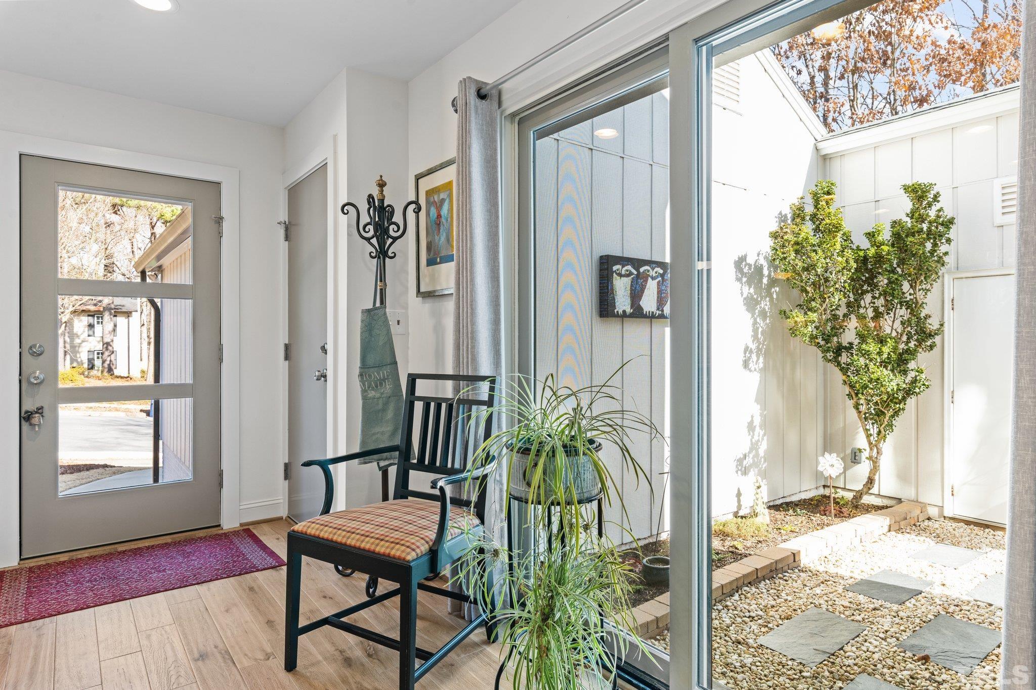 3036 Sylvania Drive Raleigh, NC 27607 - Photo 40 of 59 a view of a entryway with wooden floor and chair