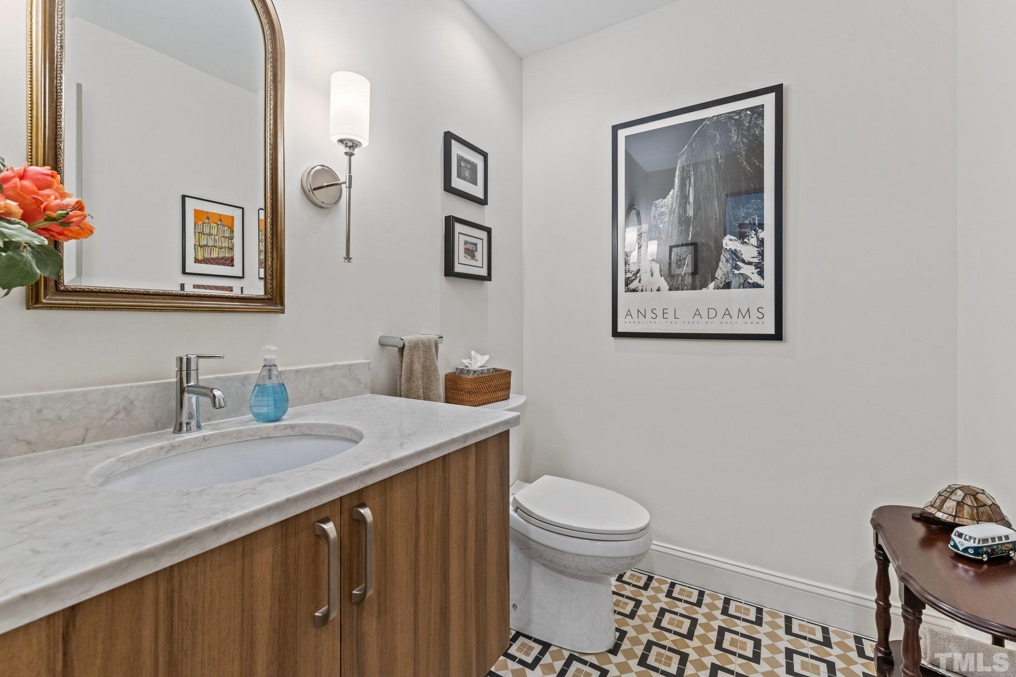 3036 Sylvania Drive Raleigh, NC 27607 - Photo 41 of 59 a bathroom with a granite countertop sink mirror vanity and toilet