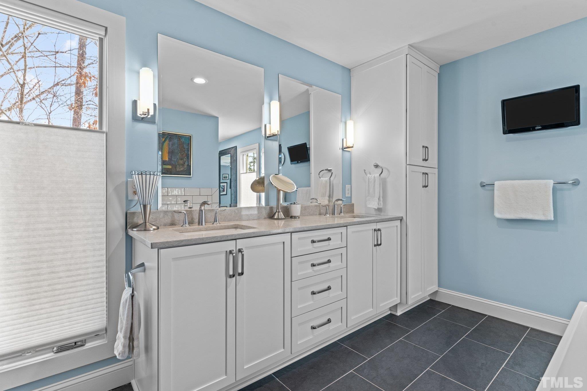 3036 Sylvania Drive Raleigh, NC 27607 - Photo 47 of 59 a bathroom with a granite countertop sink mirror and double