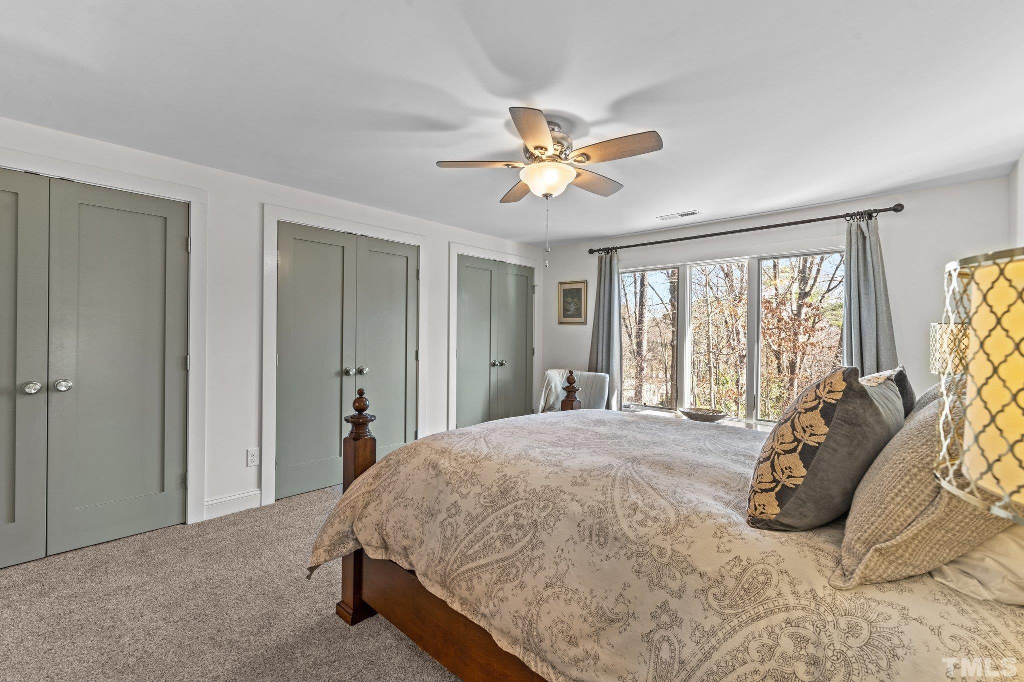 3036 Sylvania Drive Raleigh, NC 27607 - Photo 52 of 59 a bed sitting in a spacious bedroom next to a window