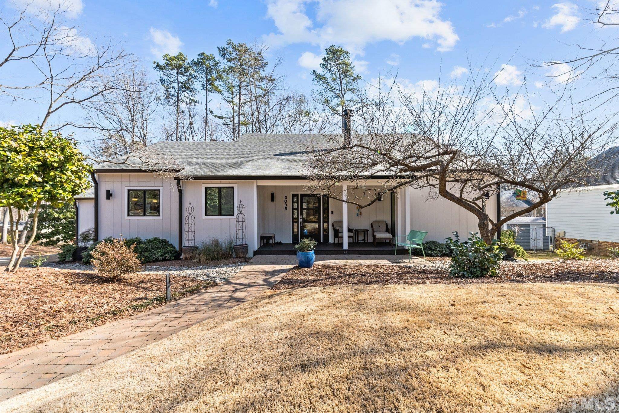 3036 Sylvania Drive Raleigh, NC 27607 - Photo 8 of 59 a front view of a house with a patio