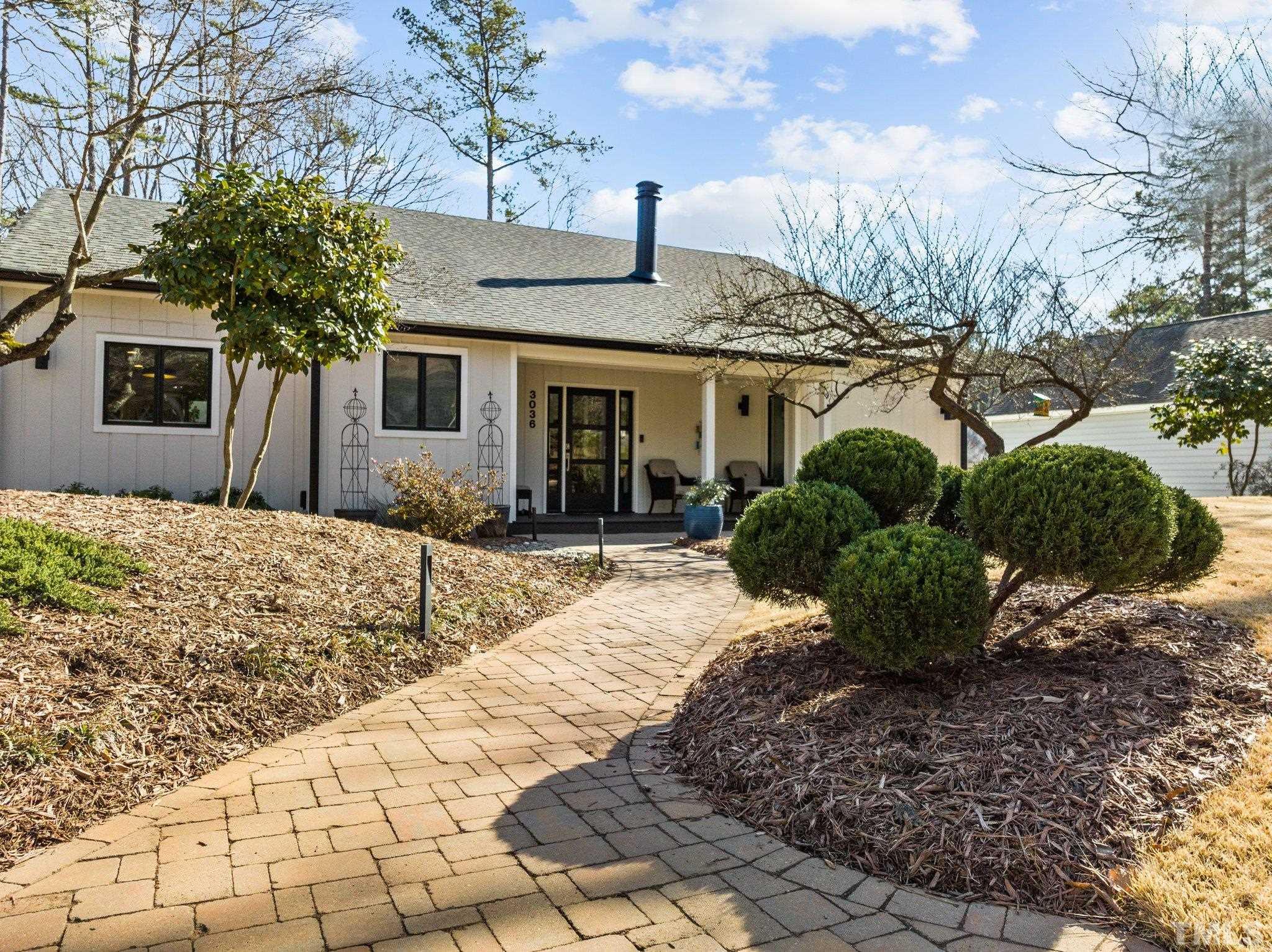 3036 Sylvania Drive Raleigh, NC 27607 - Photo 9 of 59 a front view of a house with garden