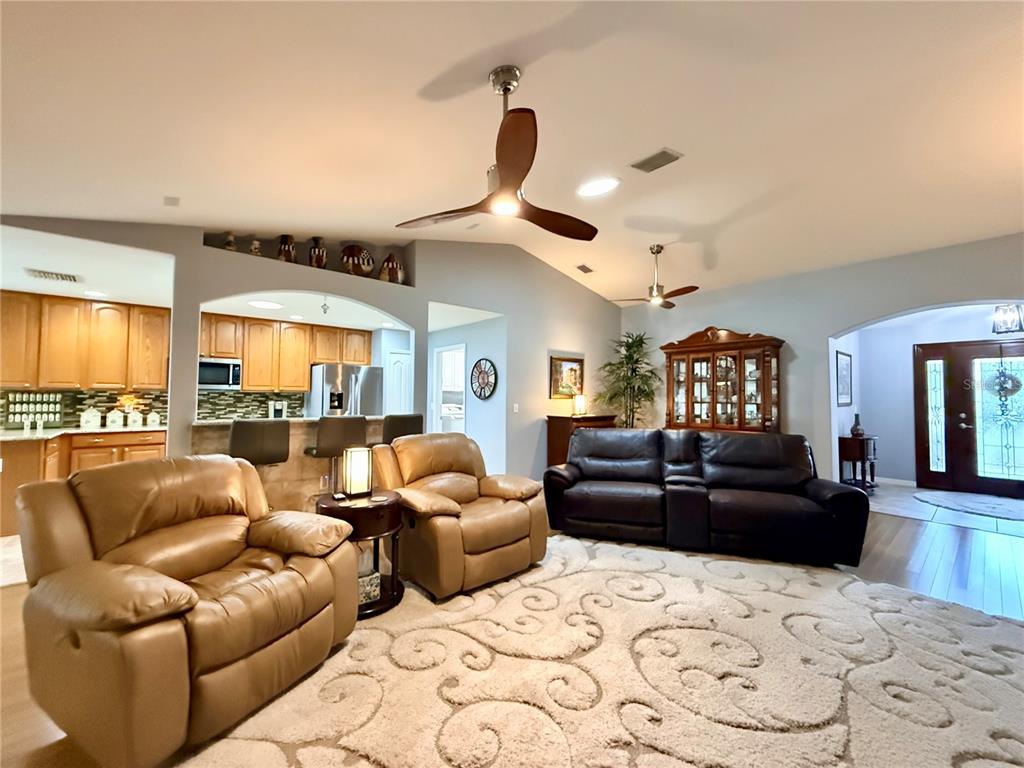 16296 Southwest 15th Court Ocala, FL 34473 - Photo 12 of 70 a living room with furniture fireplace and a large window