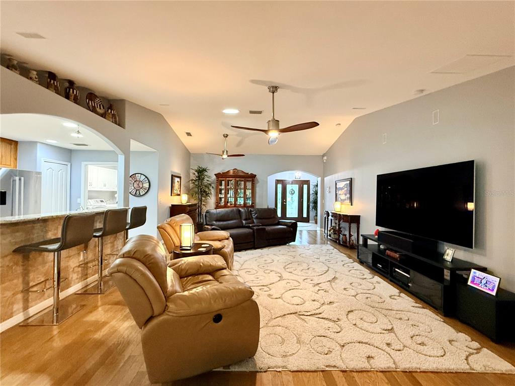 16296 Southwest 15th Court Ocala, FL 34473 - Photo 14 of 70 a living room with furniture and a flat screen tv
