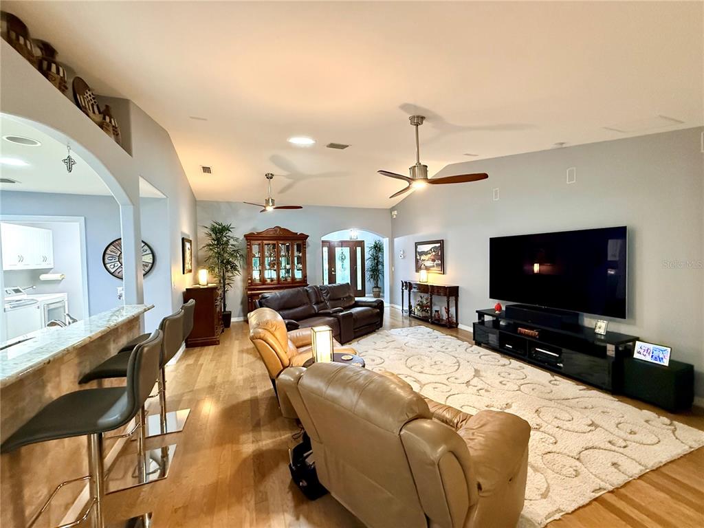 16296 Southwest 15th Court Ocala, FL 34473 - Photo 15 of 70 a living room with furniture and a flat screen tv
