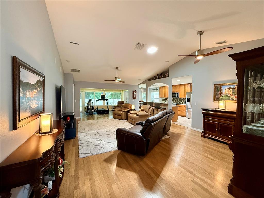 16296 Southwest 15th Court Ocala, FL 34473 - Photo 16 of 70 a living room with furniture and a flat screen tv