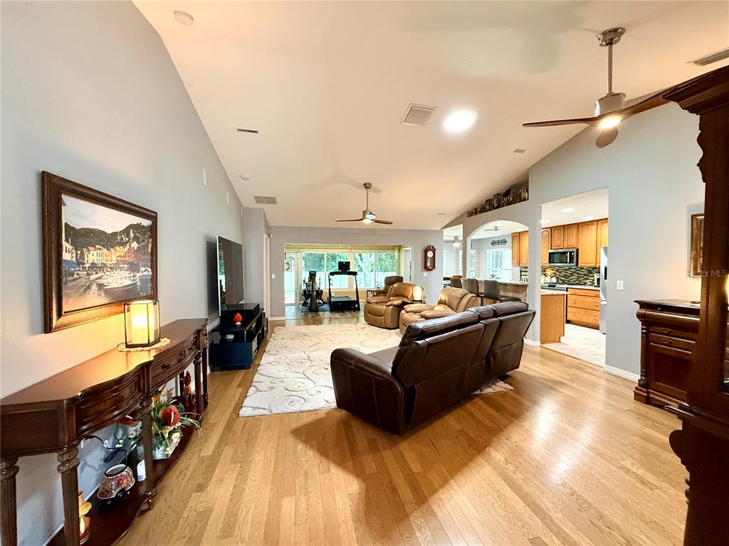 16296 Southwest 15th Court Ocala, FL 34473 - Photo 17 of 70 a living room with furniture and a flat screen tv