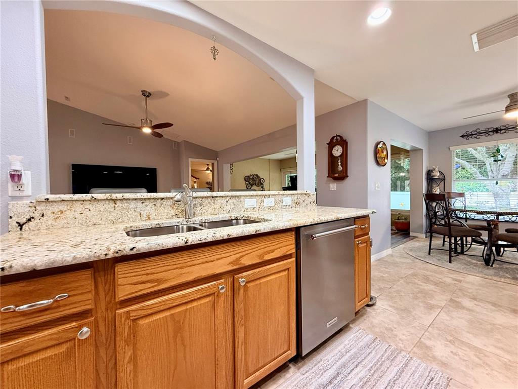 16296 Southwest 15th Court Ocala, FL 34473 - Photo 19 of 70 a spacious bathroom with a granite countertop sink and a mirror