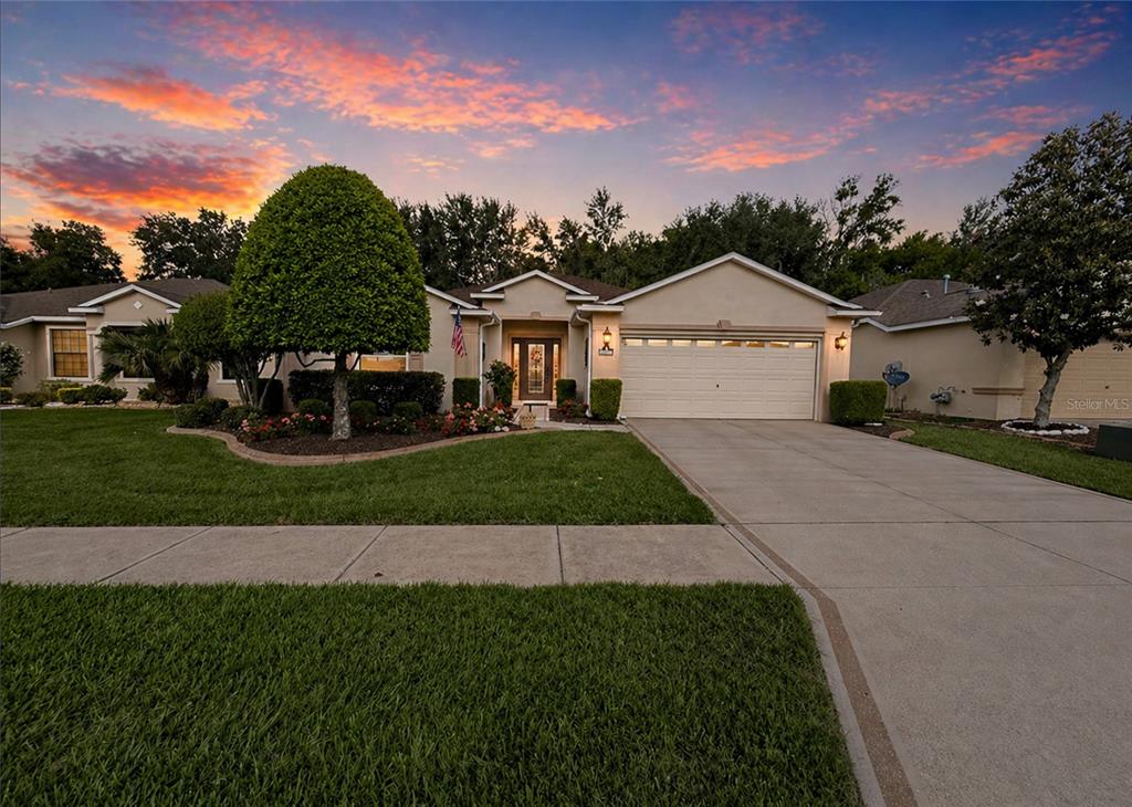 16296 Southwest 15th Court Ocala, FL 34473 - Photo 2 of 70 a front view of a house with a garden