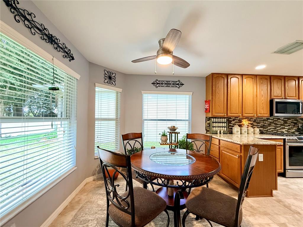 16296 Southwest 15th Court Ocala, FL 34473 - Photo 30 of 70 a view of a dining room with furniture window and outside view