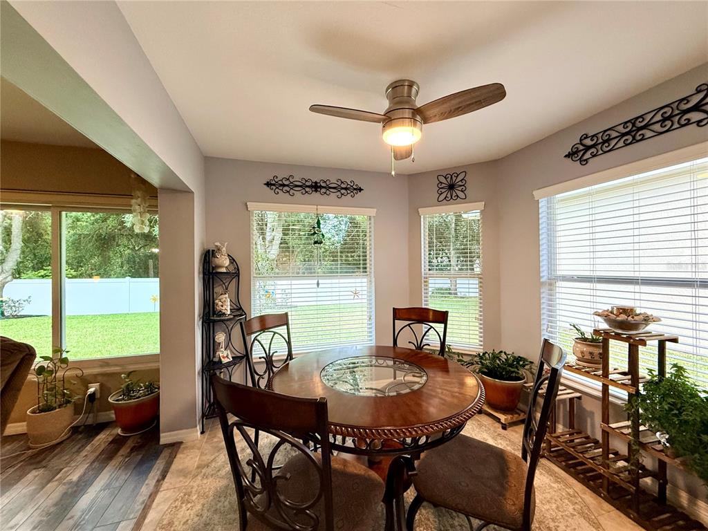 16296 Southwest 15th Court Ocala, FL 34473 - Photo 31 of 70 a view of a dining room with furniture window and outside view