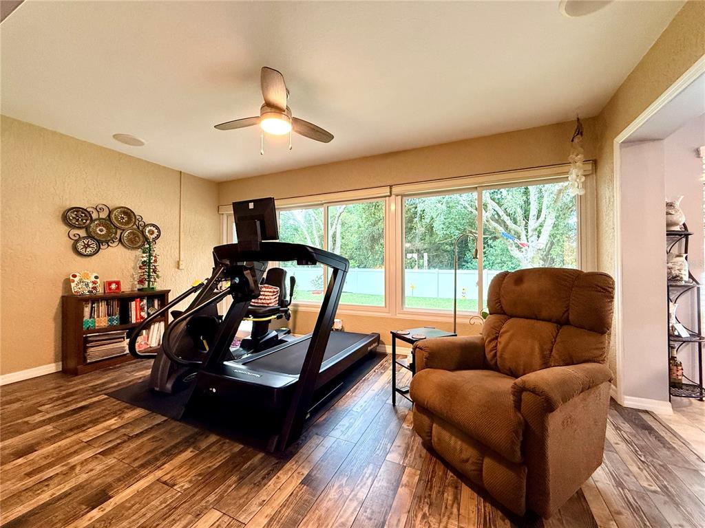 16296 Southwest 15th Court Ocala, FL 34473 - Photo 33 of 70 a living room with furniture and a large window