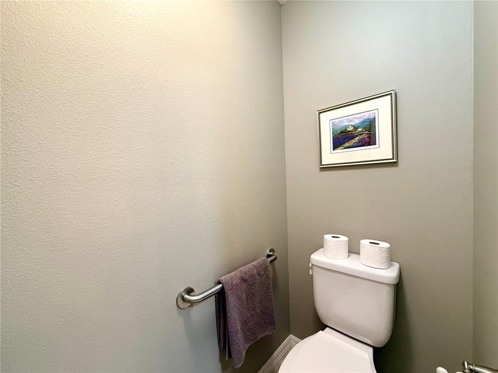 16296 Southwest 15th Court Ocala, FL 34473 - Photo 45 of 70 a white toilet sitting next to a white wall